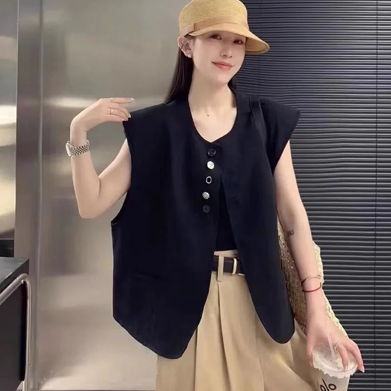 Women's loose fit polyester vest in milky white, featuring a short length and a front pocket.