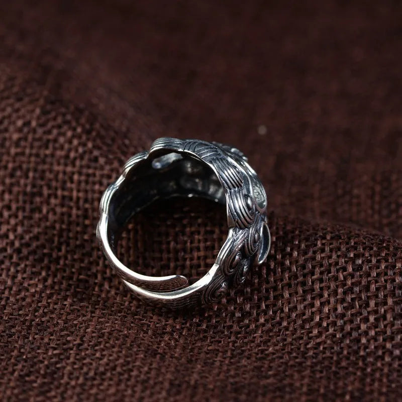 Silver open ring with detailed animal and zodiac modelling in jibeast pattern, retro style