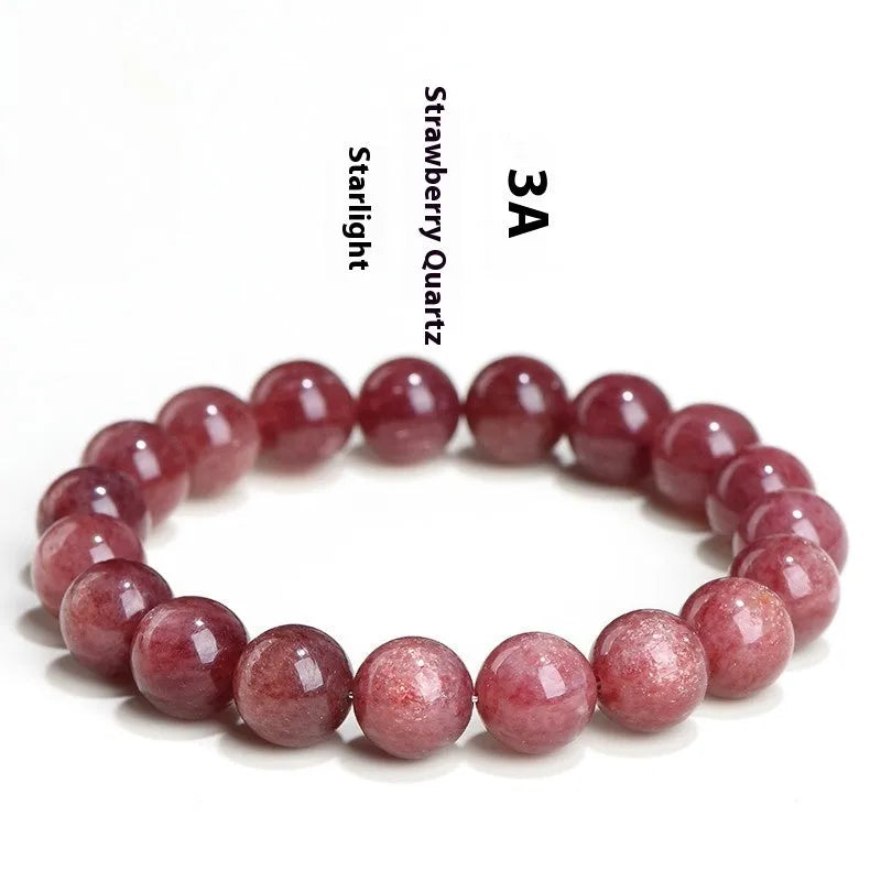 Natural red strawberry quartz crystal bracelet with geometric cut beads, shown in unisex styling.