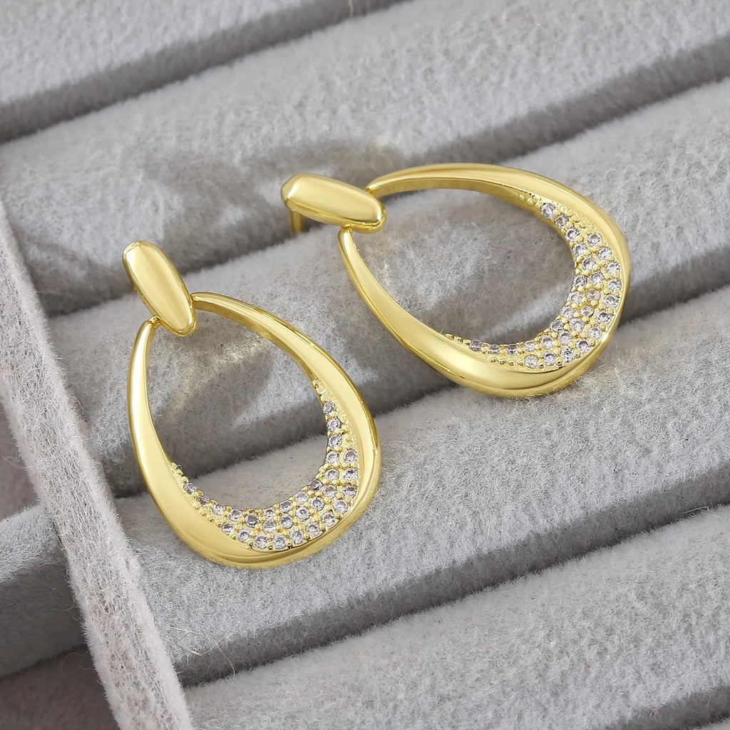 Yellow gold geometric drop earrings with zircon detailing on copper base, measuring 2.6cm