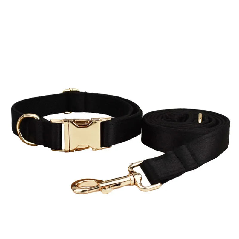Cloth dog harness set with leash, red bow tie, and blue reflective safety vest laid out on a white background.