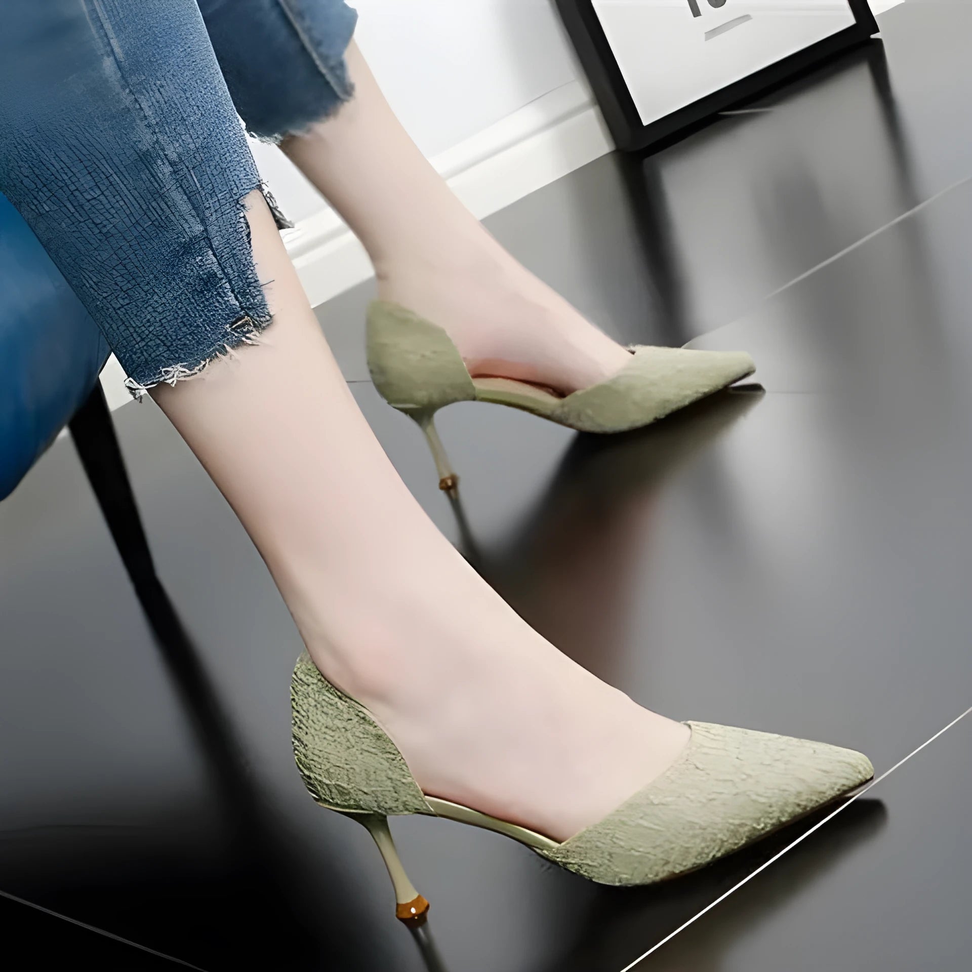Women's black pointed toe stiletto high heels with PU leather upper on a plain background.