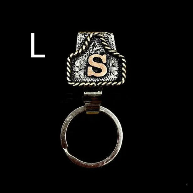 Handmade metal keychain with a cow tag charm in one of 26 available colour options.