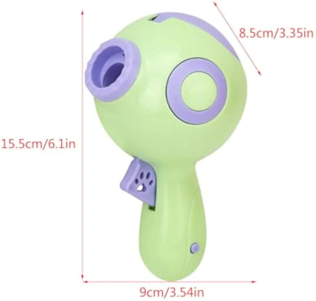 Green, orange, and pink dog treat launcher toy shown next to a measuring tape indicating 15.5 cm length.