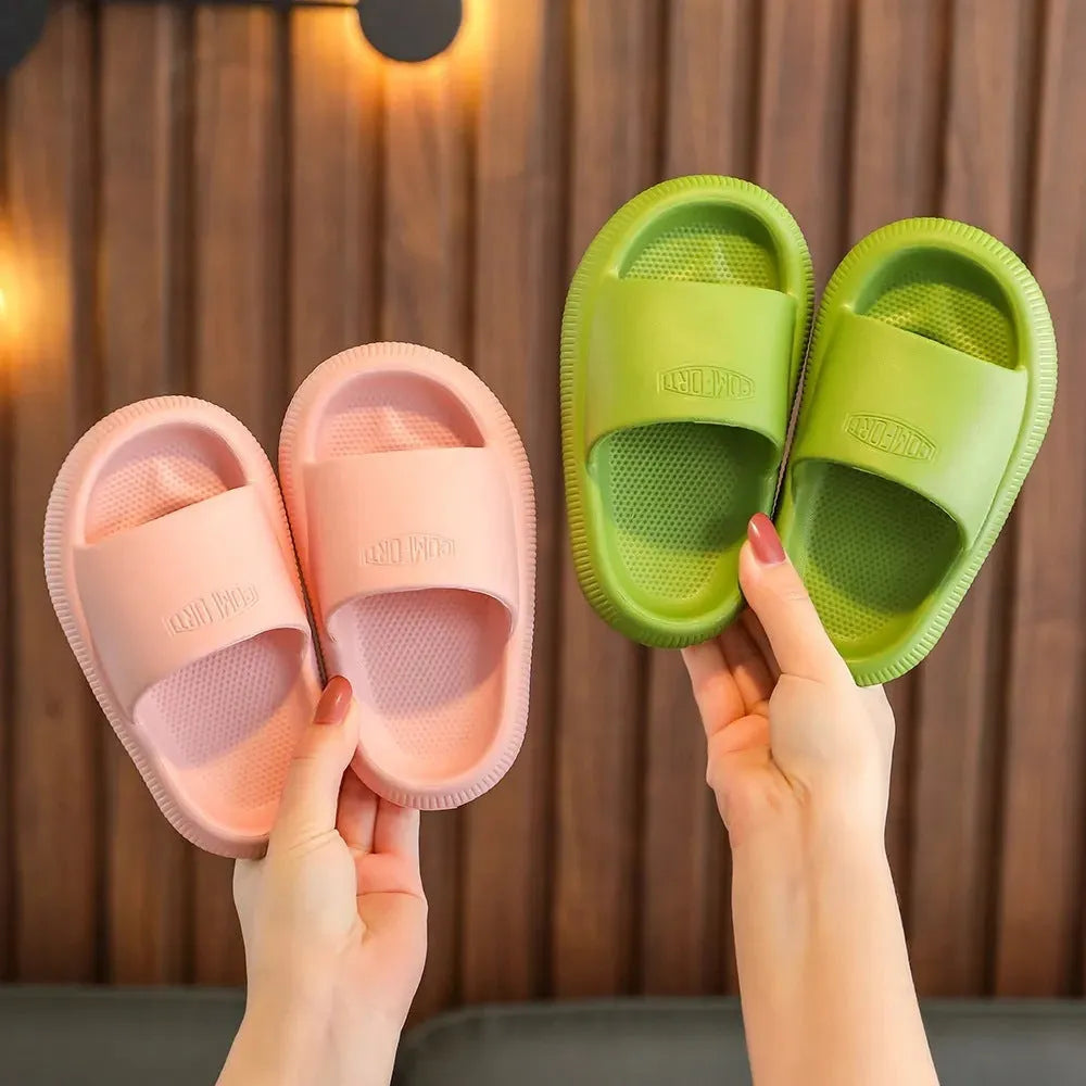 Children's bright coloured EVA slippers with non-slip soles in blue, green, orange, pink, and yellow.