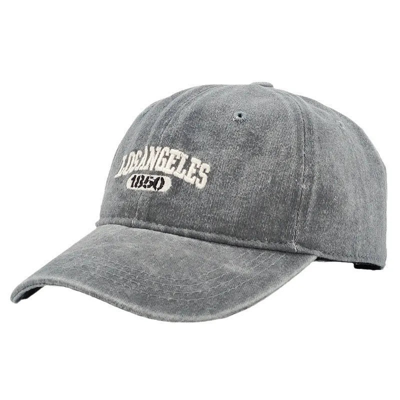 Retro-style personalised baseball cap with distressed letter embroidery on an adjustable strap, shown in beige colour.