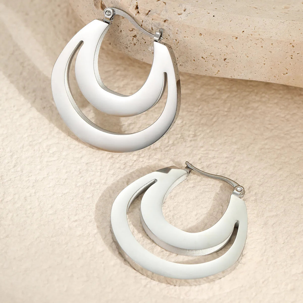 Geometric French earrings with round hoop design in gold and steel colour options