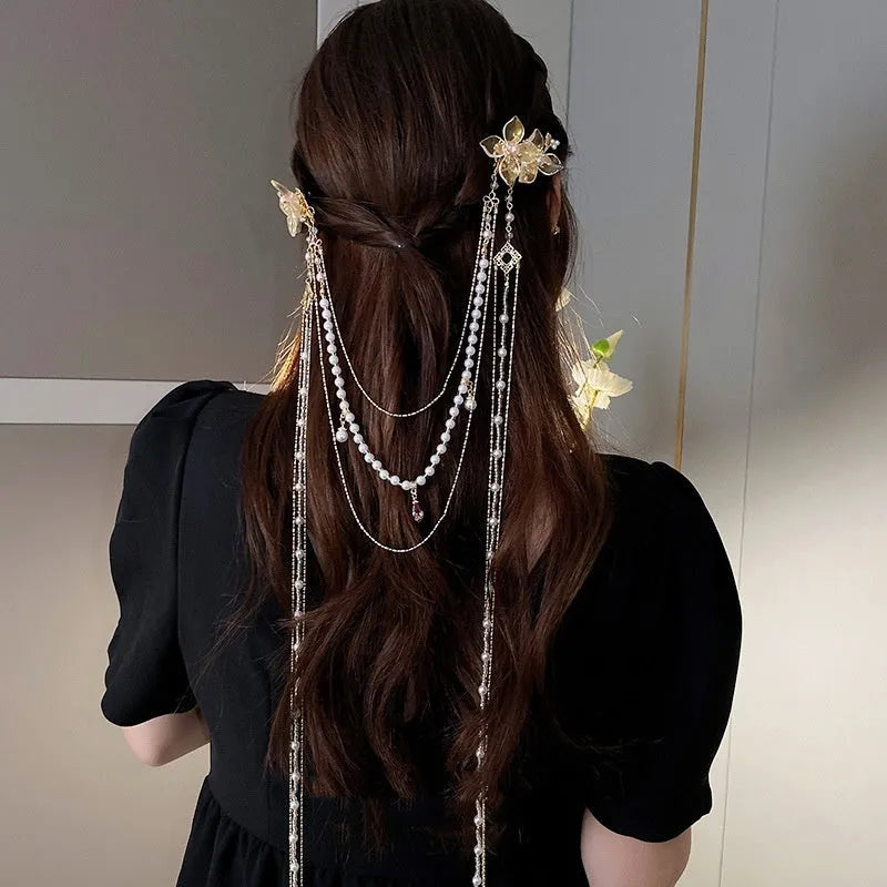 Gold women's hairpin with pearl flower decoration and long tassel detail
