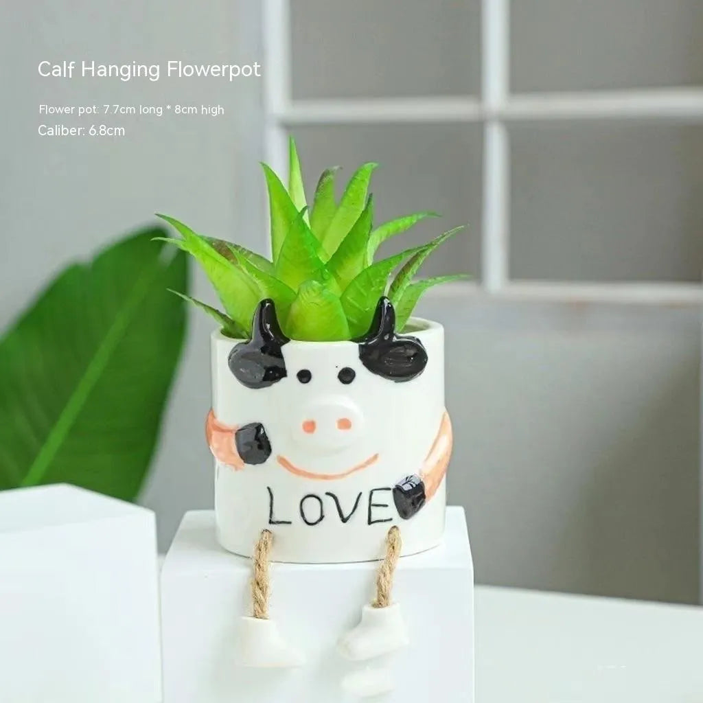 Ceramic hanging foot flowerpot with cartoon design in one of twelve colour variants for succulent plants