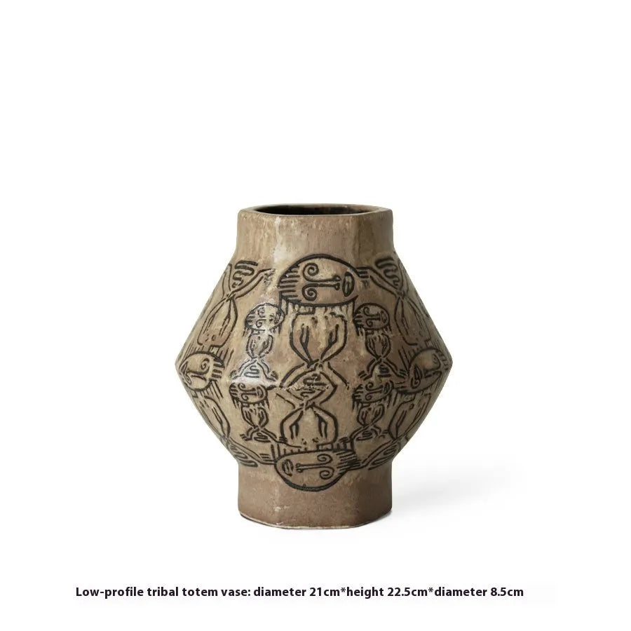 Hand-painted ceramic cylindrical vase with carved tribal totem vintage design.