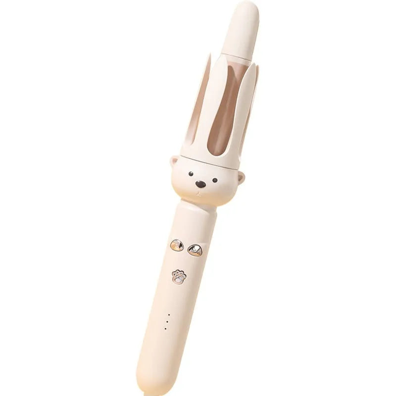 Beige anion automatic hair curler with wired power cord and included hair stick on a white background.