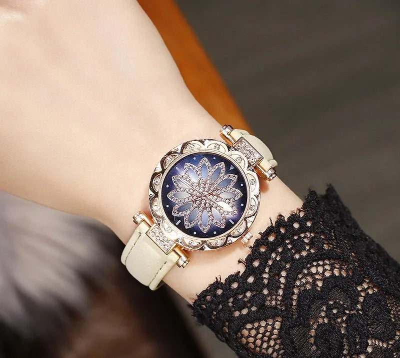 Women's full diamond bezel watch with round dial in multiple colour options showing pin buckle clasp