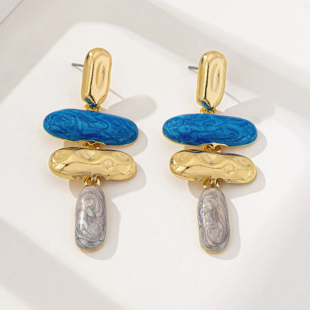 A pair of simple geometric stud earrings with a multicolour electroplated finish.