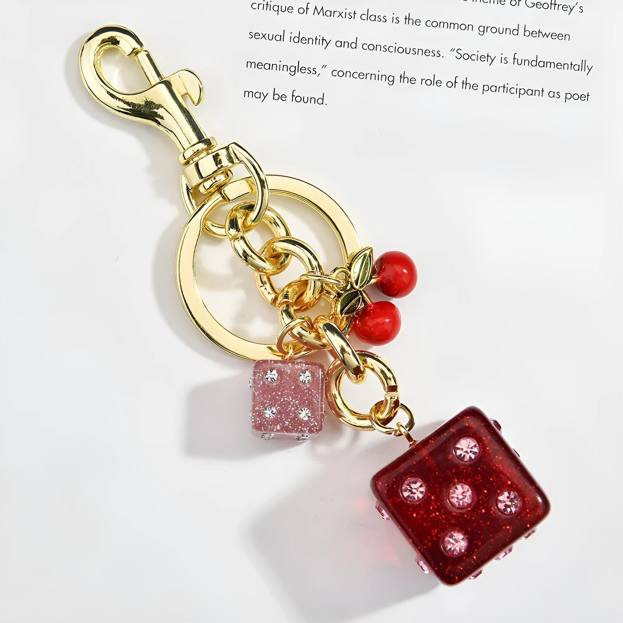 Square metal dice keychain pendant with cherry two-tone electroplated finish on a keyring