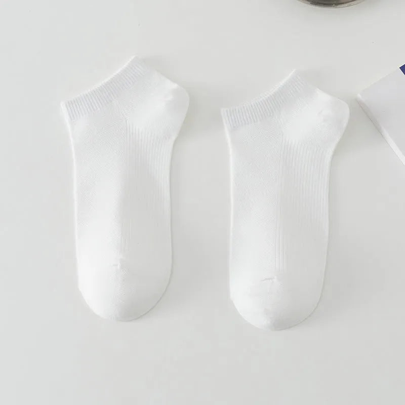 Men's low-cut solid colour boat socks made from breathable polyester, shown in one of six available colour options.