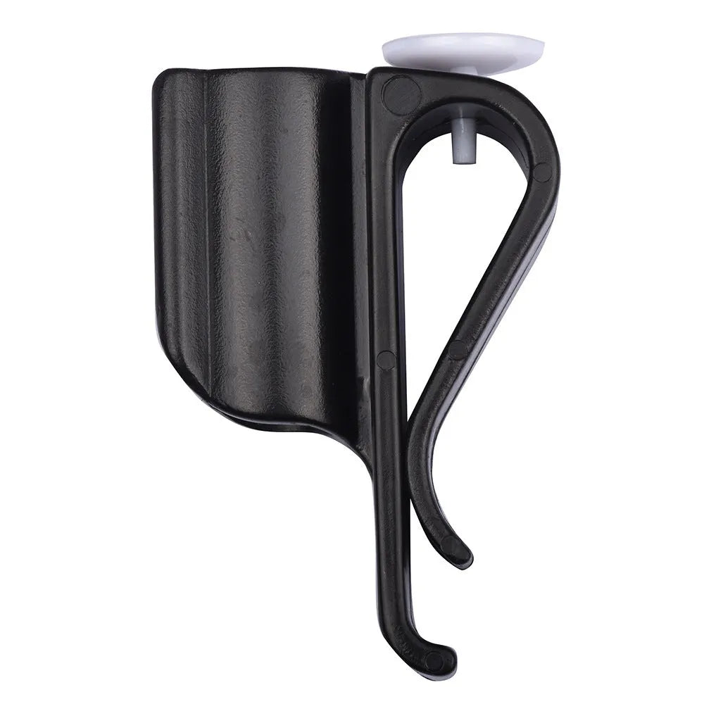 Black plastic putter fixing clip attached to golf bag, holding a putter securely