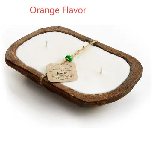 Lavender-coloured wooden basin containing a soy wax aromatherapy candle with three wicks.