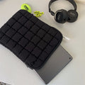 Black nylon laptop bag with cloud cotton interior padding shown next to a white version, sized for a 15.6-inch laptop.