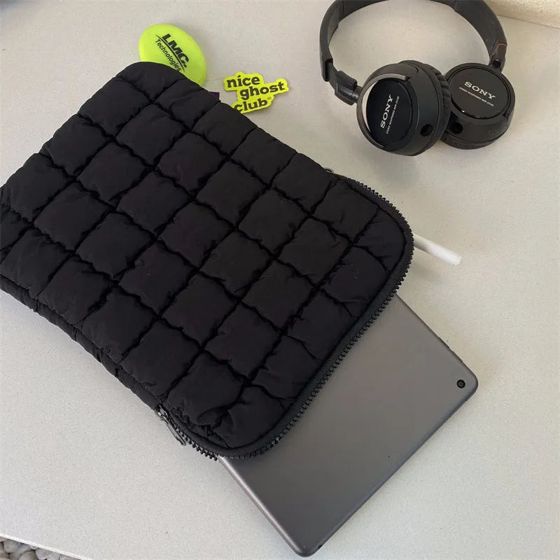 Black nylon laptop bag with cloud cotton interior padding shown next to a white version, sized for a 15.6-inch laptop.