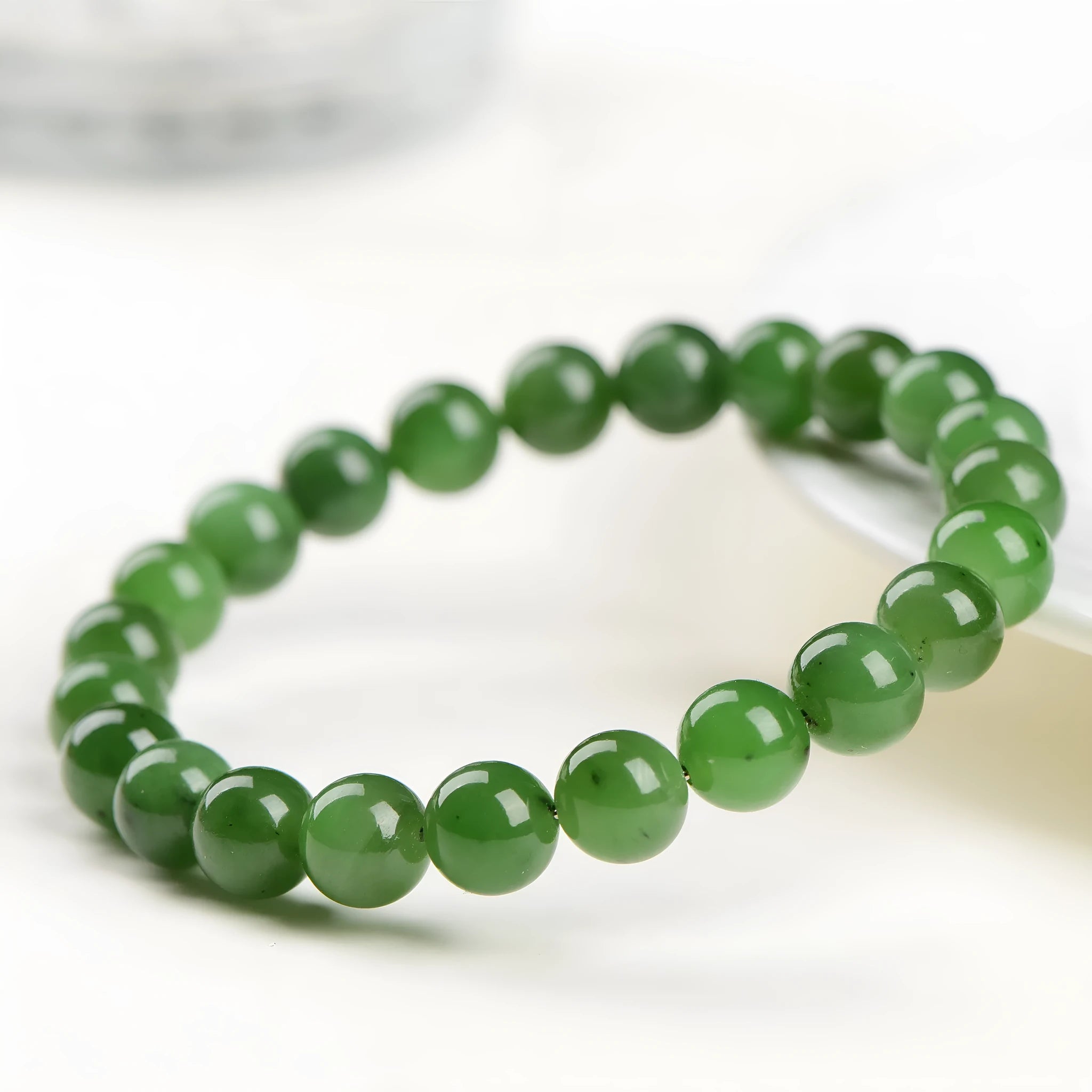 Natural Hetian jade jasper bead bracelet with polished finish in earthy green tones