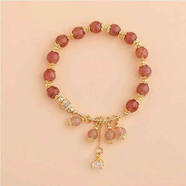 Pink adjustable women's bracelet with heart-shaped strawberry quartz crystal and freshwater pearl accents