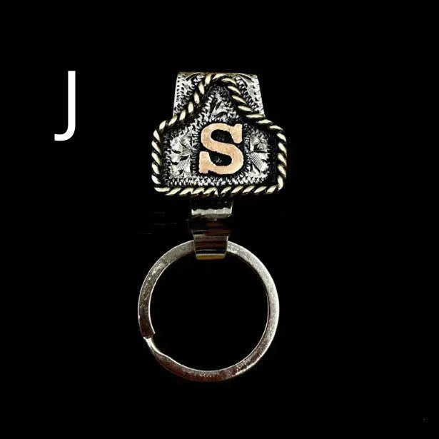 Handmade metal keychain with a cow tag charm in one of 26 available colour options.