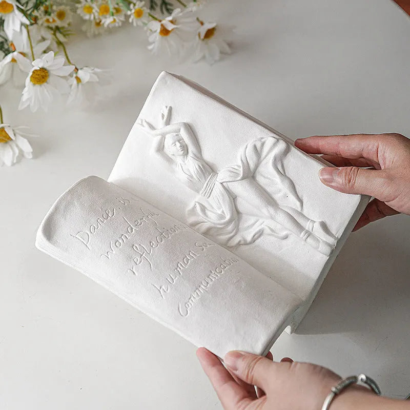 Glazed ceramic book stand in one of four artistic styles: lover, dancer, beauty and beast, or brushed face.
