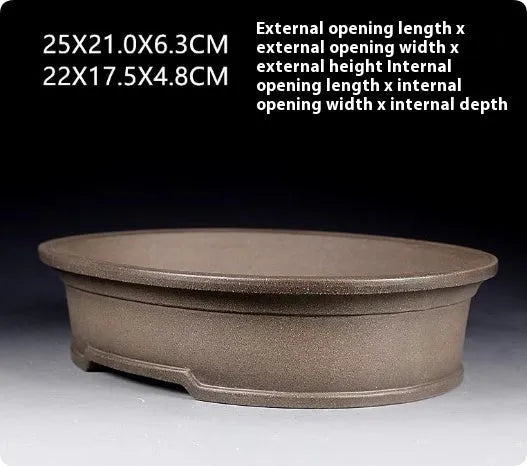 Handmade purple sand ceramic oval bonsai flower pot showing antique finish and 25cm length.