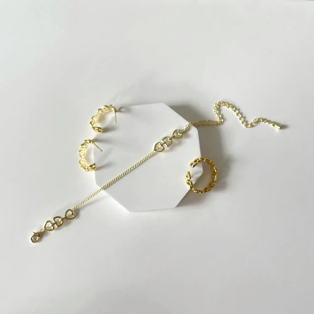 Copper geometric fashion jewelry set with ring, earrings, and bracelet, electroplated gold-plated finish inlaid artificial gems