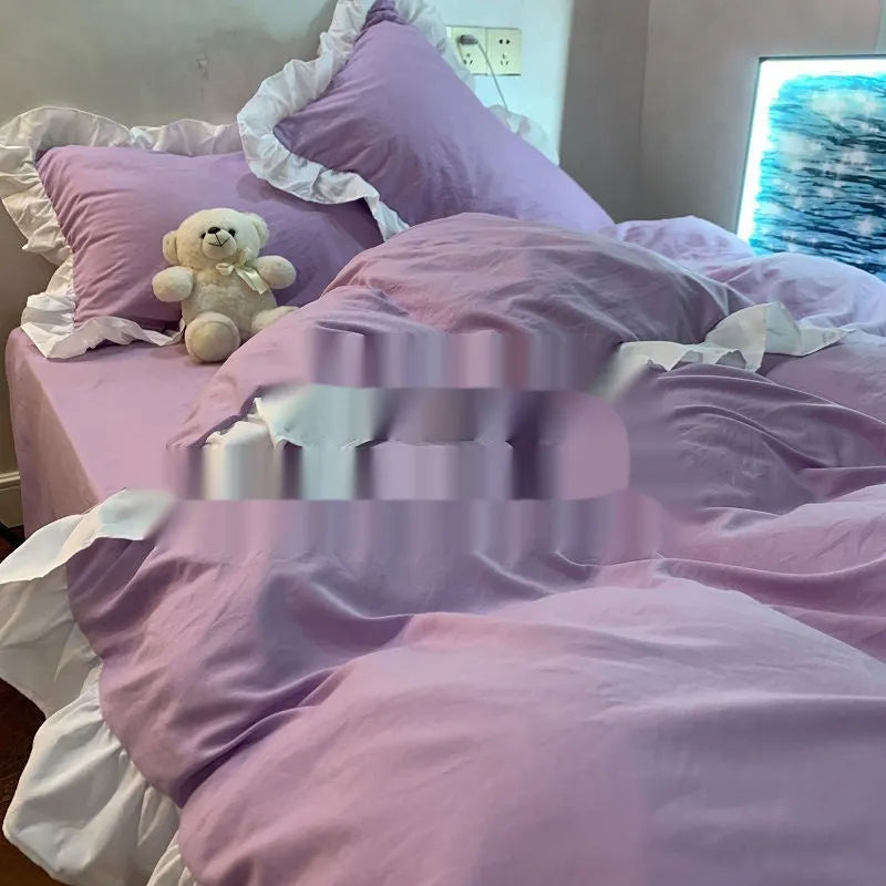 Solid colour washed linen quilt cover and pillowcases from a mori style four-piece bedding set.