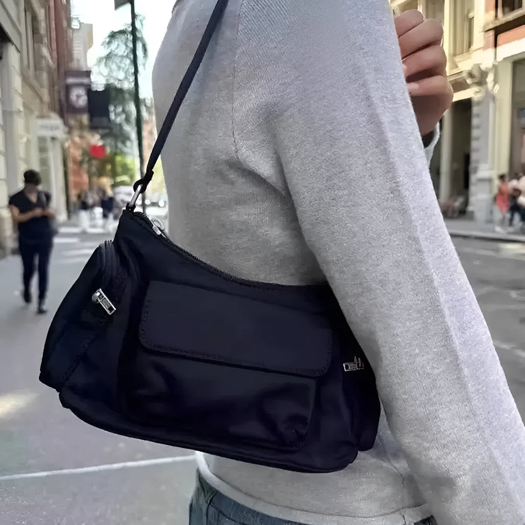 Black PU nylon double pocket shoulder bag with side line detail showing compact dimensions