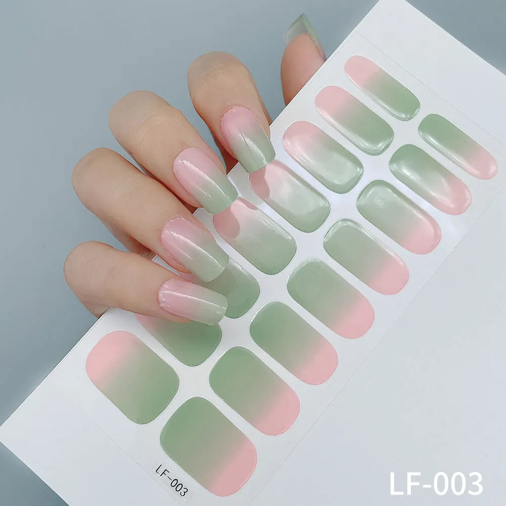 Set of 16 solid colour full nail art stickers showing patterns like cross, rose, tulip, and cartoon designs.