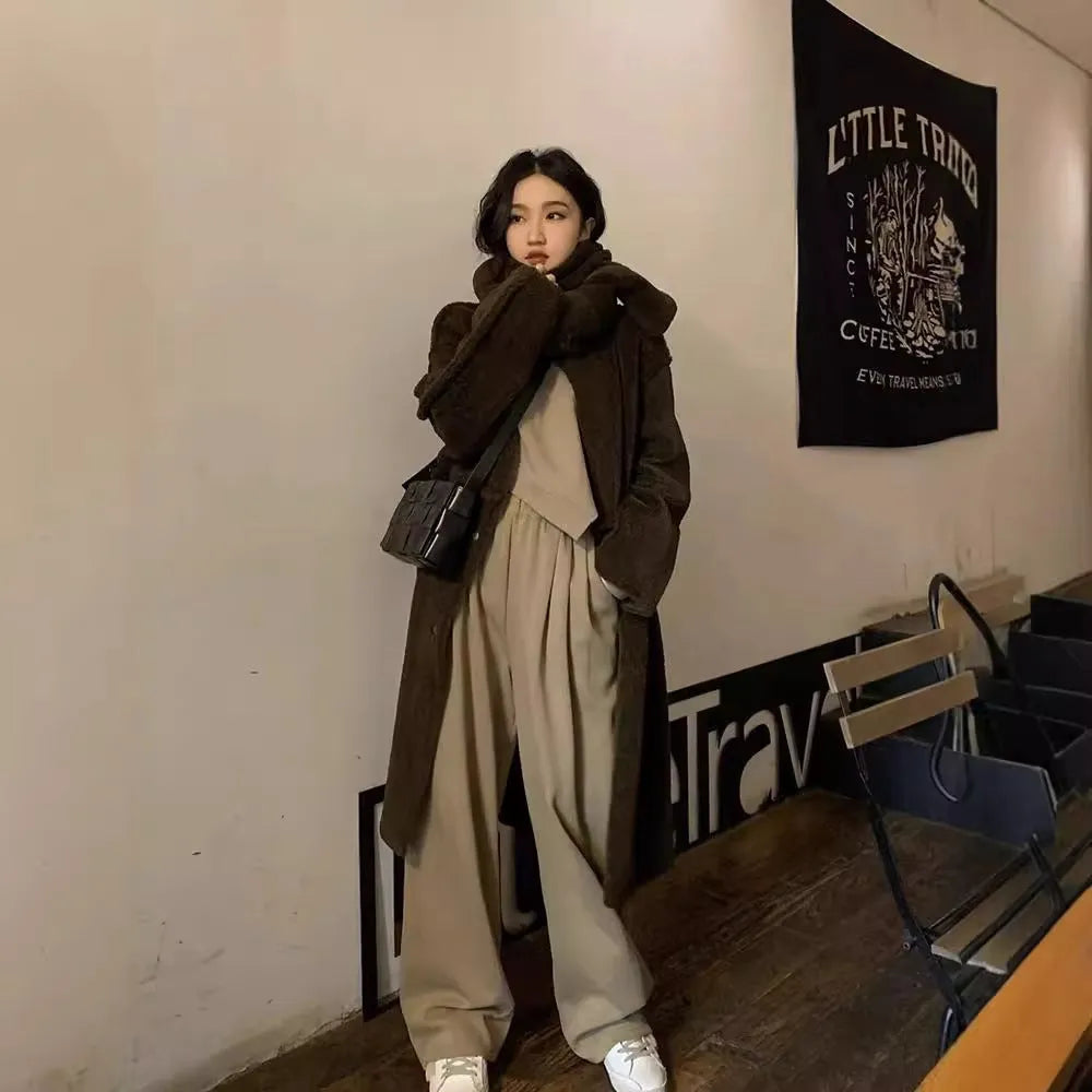 Women's khaki coloured loose-fitting sports suit with long sleeve top and full length trousers