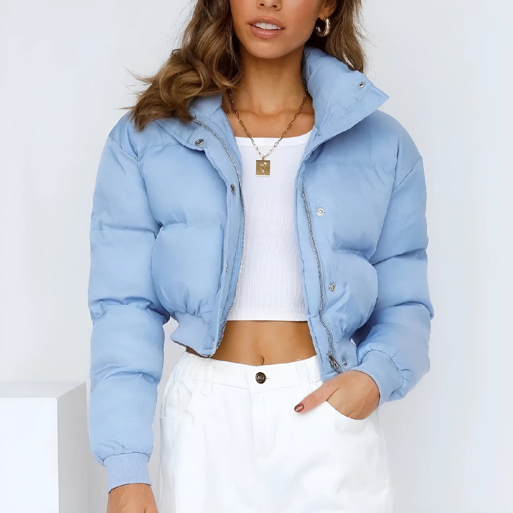 Women's loose blue polyester casual jacket with long sleeves on a hanger.