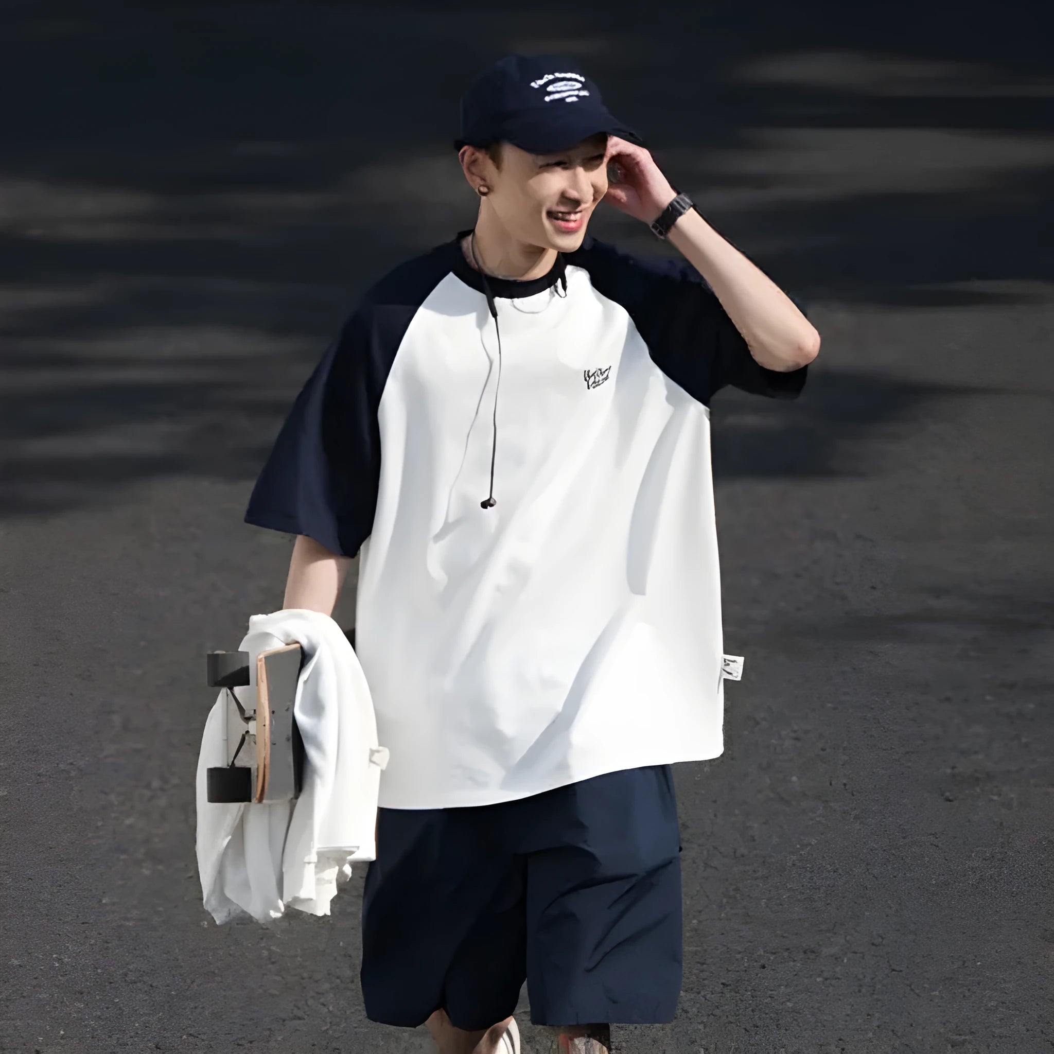 Blue loose-fit men's raglan sleeve T-shirt on a hanger, front view.