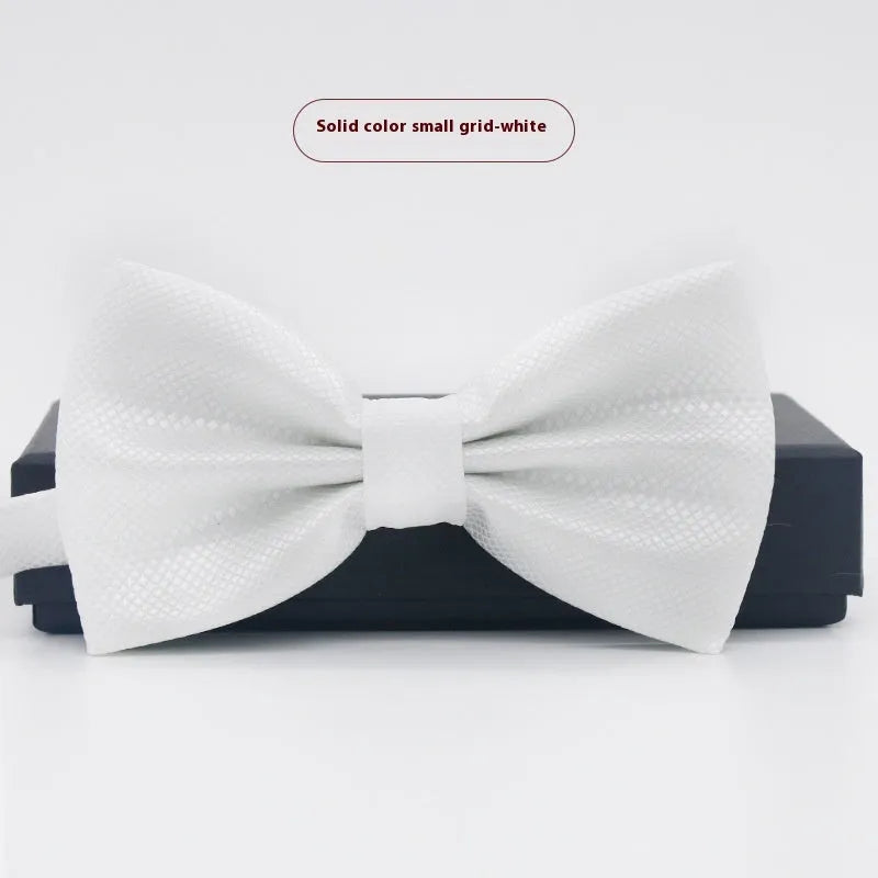 Solid colour polyester bow tie with flat head design measuring 12cm by 6cm