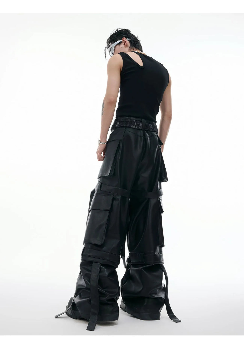 Black loose fit retro pants with multiple pockets, quilted stitching details and ribbon trim