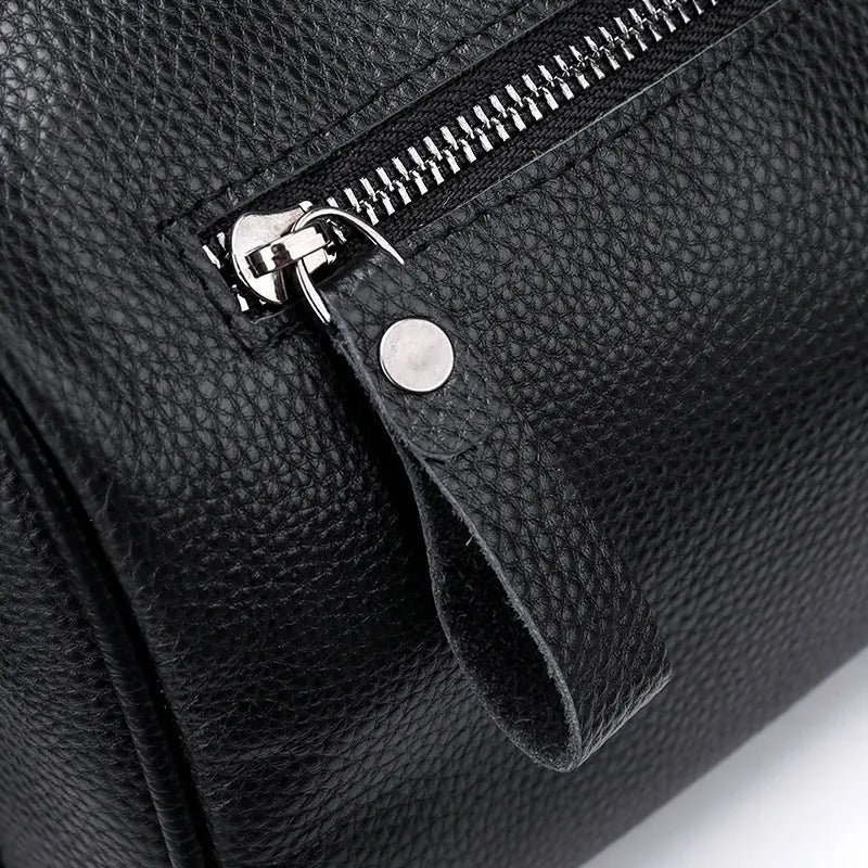 Black genuine leather crossbody bag with dimensions 24cm wide by 16cm high by 13cm deep