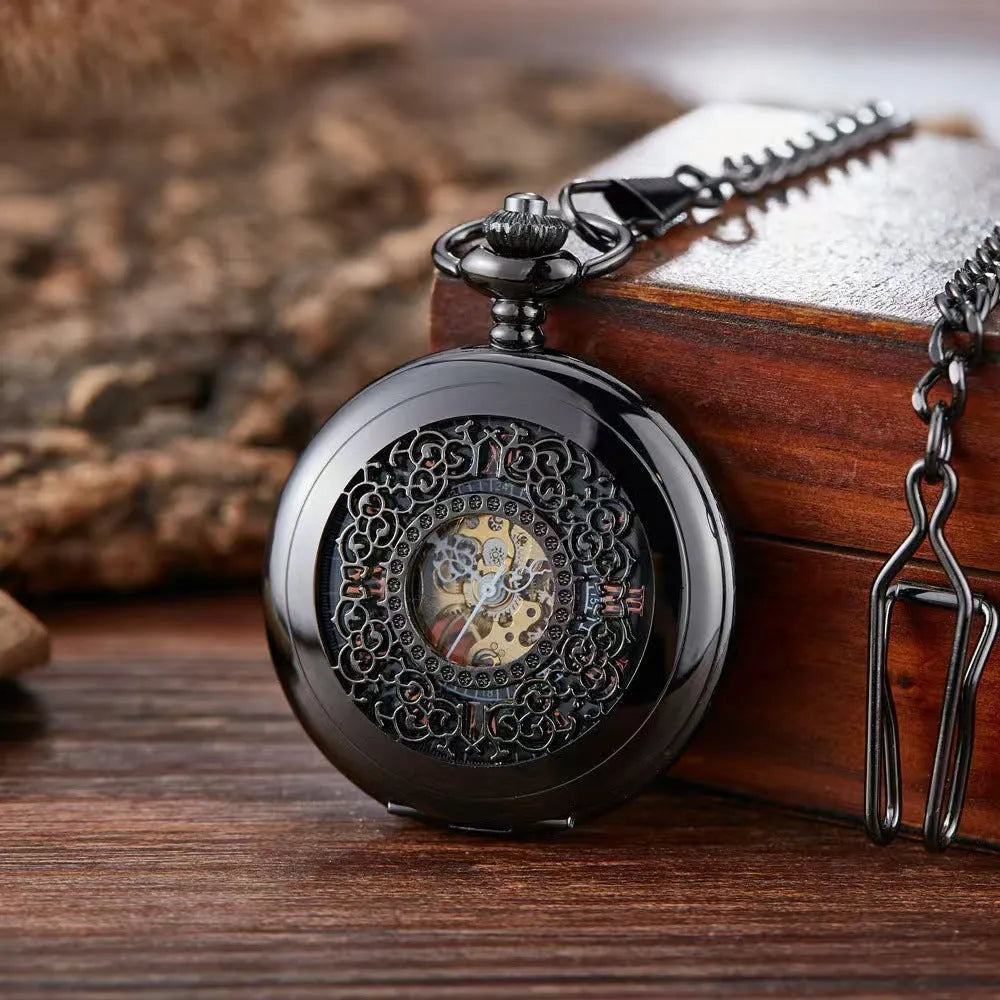 Retro hollow floral print mechanical pocket watch with transparent case back in gold colour.