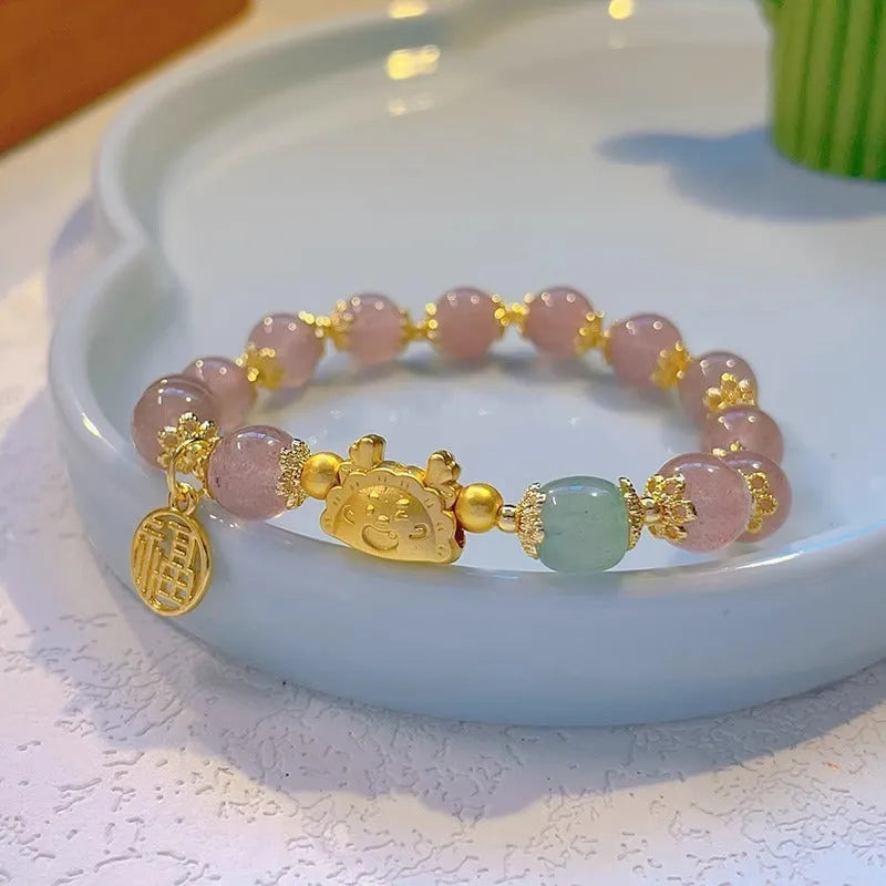 Women's floral glazed bracelet with ice crack texture and zodiac animal charm on wrist.