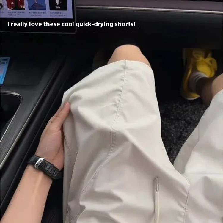 Men's quick-drying polyester sports shorts in straight-leg fifth-length design