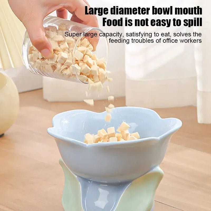 Blue floral patterned ceramic pet bowl with elevated design and non-slip base for cats and small dogs