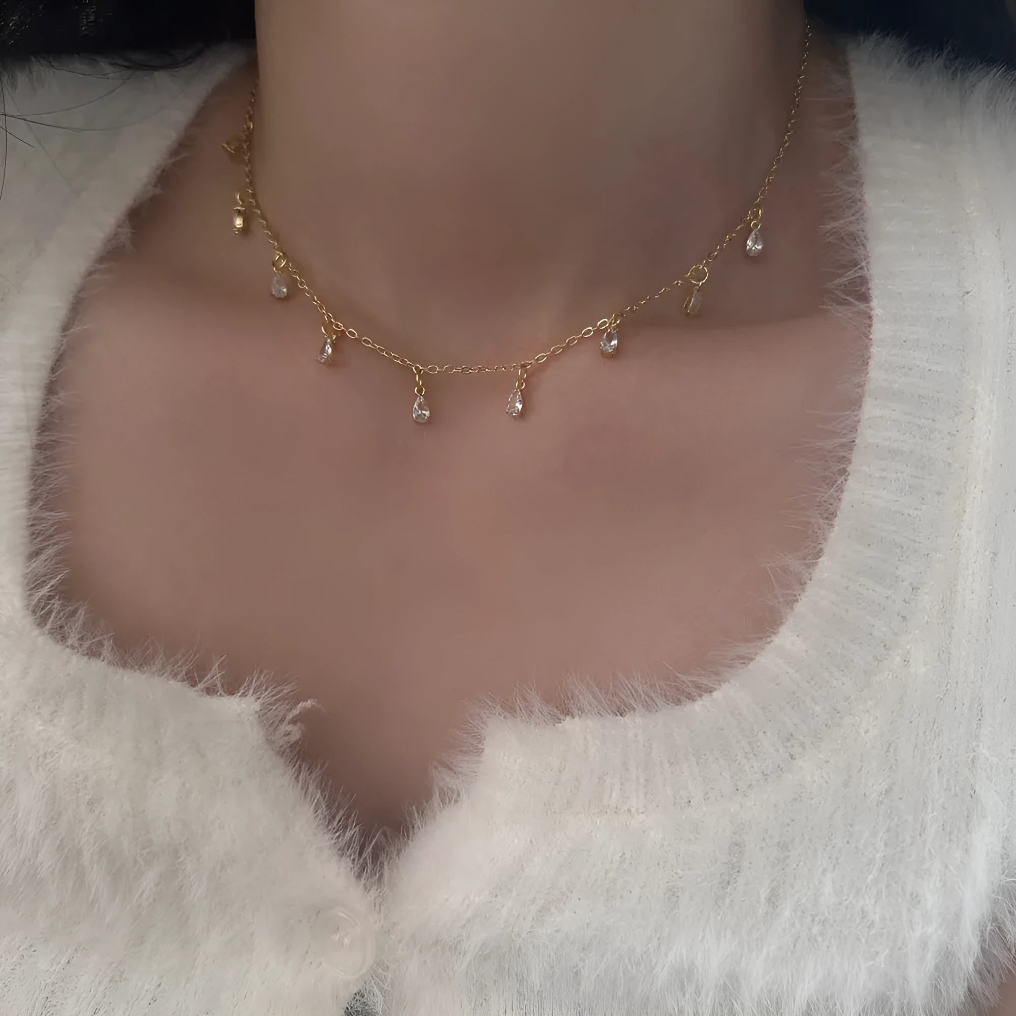 Women's zircon jewellery set showing geometric pendant necklace, matching earrings, and anklet on a white background.