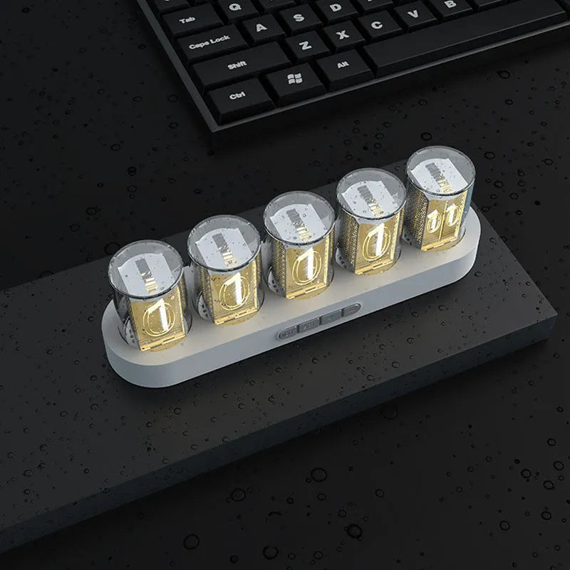 RGB LED digital clock showing colour-changing display on desk with black plastic casing