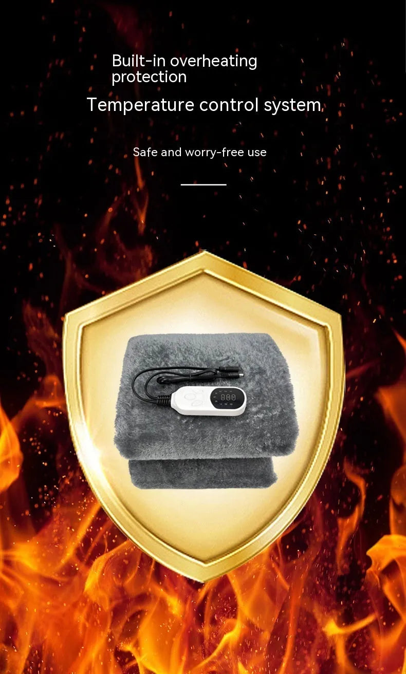 Grey 12V car electric blanket plugged into a vehicle cigarette lighter socket.