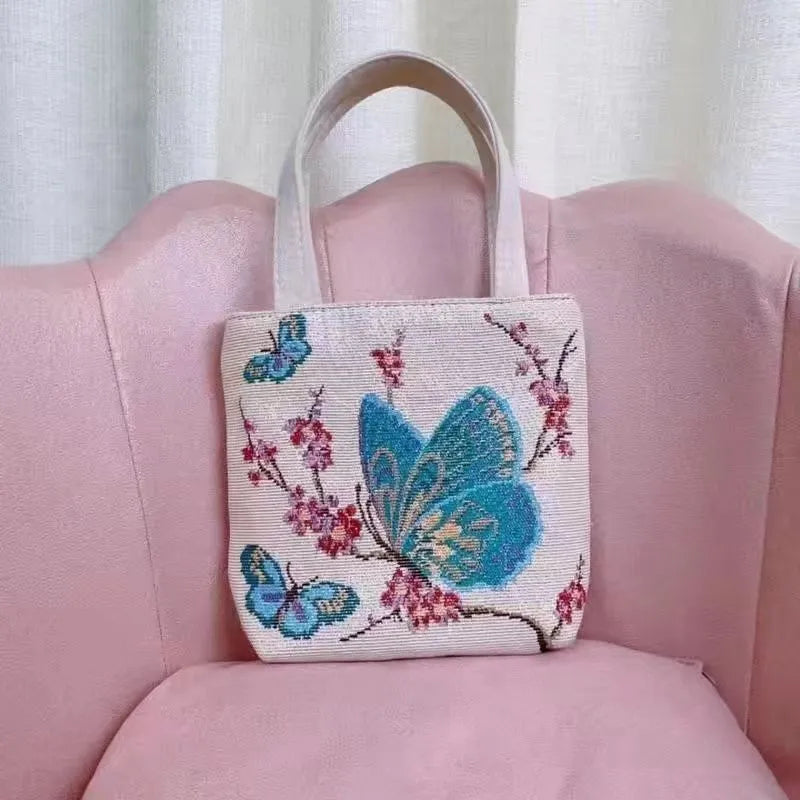 Double-sided gold wire embroidered canvas tote bag showing Bunny design with reinforced base