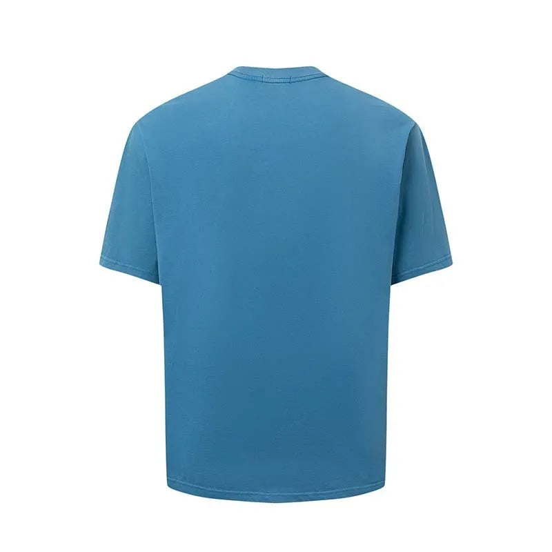 Man wearing a blue loose-fit American retro t-shirt with a white letter print design.