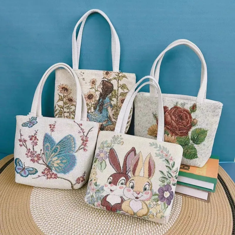 Double-sided gold wire embroidered canvas tote bag showing Bunny design with reinforced base