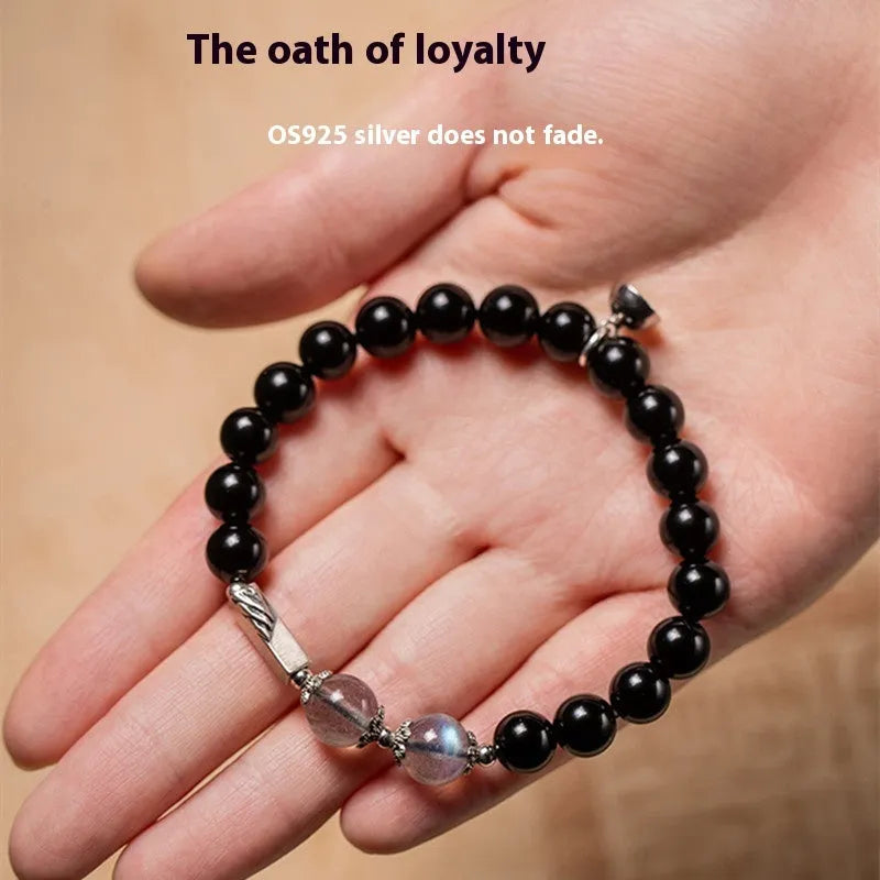 Obsidian couple bracelet DIY set with 8mm and 10mm Buddha beads on adjustable string.