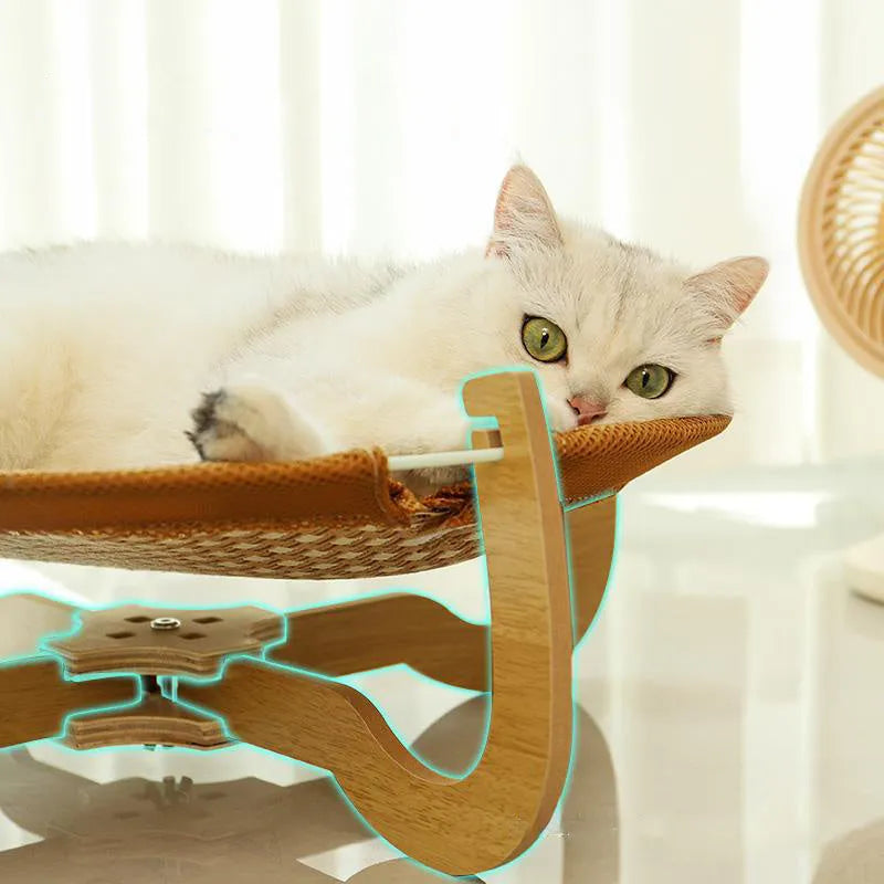 Brown square woven rattan raised hammock bed for cats and dogs on a wooden floor.